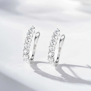 Elegant 925 sterling silver hoop earrings featuring a row of seven brilliant moissanite stones
