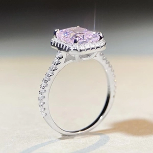 925 silver ring featuring a radiant cut pink rectangle gemstone with halo diamond pave