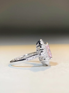 Detailed side view showing the intricate setting of a pink square cut crystal ring