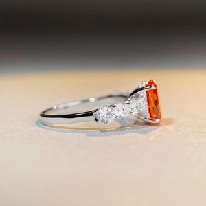 Elegant s925 silver ring featuring 3ct orange rectangle gemstone with diamond accents