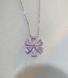 Detailed view of s925 silver necklace with pink zircon flower pendant and fine chain