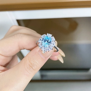 Elegant S925 sterling silver sky blue oval cluster ring with sparkling zircon halo