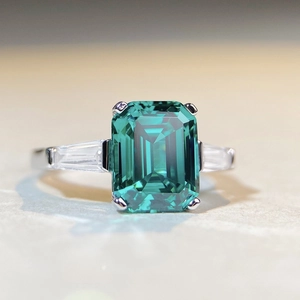 Classic 925 sterling silver ring featuring emerald cut green zircon and trapezoid side stones