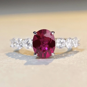 Oval cut ruby ring in S925 sterling silver with sparkling side cubic zirconia stones