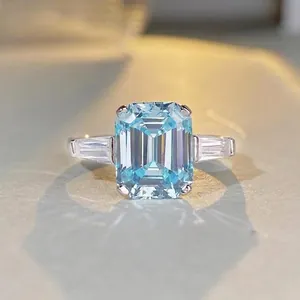 Vintage S925 silver ring with 6-carat emerald-cut light blue stone and side accents