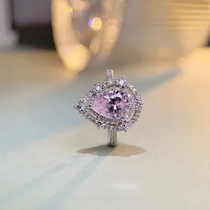 Elegant S925 silver ring featuring a pear-cut pink crystal with a double halo design