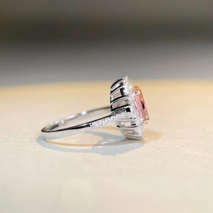 Elegant S925 sterling silver ring featuring a pink oval gemstone and halo of zircons