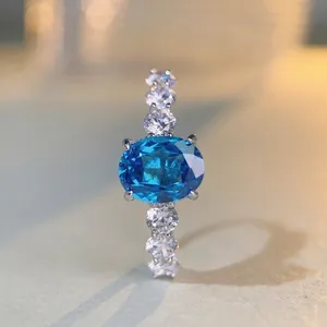 Luxurious S925 silver ring with oval aquamarine zircon and brilliant side stones