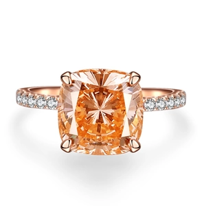 Cushion cut champagne gemstone ring in rose gold setting with diamond side stones