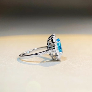 Elegant 925 silver aquamarine ring with double halo diamond setting in side view