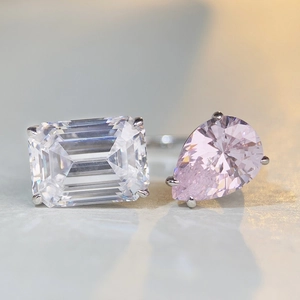 Elegant silver Toi et Moi open ring with emerald cut clear stone and pink pear gem