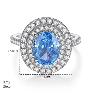 Macro detail of oval blue zircon ring with halo crystals measuring 17.1mm by 15.6mm