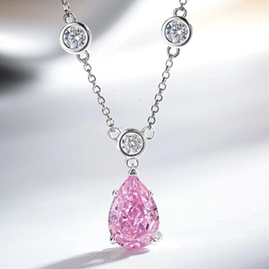 S925 sterling silver necklace featuring a pear-cut pink stone with a white drop accent