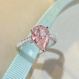 Pear cut pink carbon diamond S925 silver ring with side stones on light blue silk ribbon