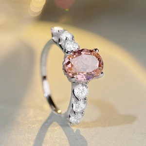 Elegant S925 silver ring featuring an oval pink gemstone and sparkling side stones