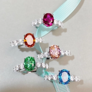 S925 sterling silver rings with colorful oval carbon diamonds on light blue ribbon