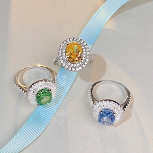 Three oval-cut halo rings in yellow, green, and blue S925 sterling silver colors