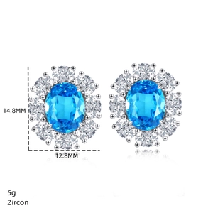 Macro shot of S925 sterling silver earrings with blue zircon and pavé crystal border