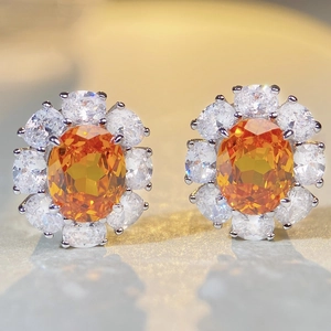 Sparkling S925 silver flower stud earrings with orange gemstone and white zircons