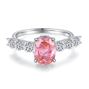 Silver S925 ring with oval pink carbon diamond and white side stones on white background