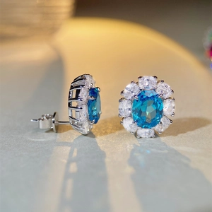 Elegant S925 sterling silver halo stud earrings with oval aquamarine and pavé crystals