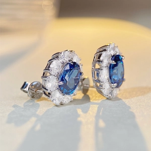 S925 sterling silver stud earrings with oval blue gemstone and zircon halo setting