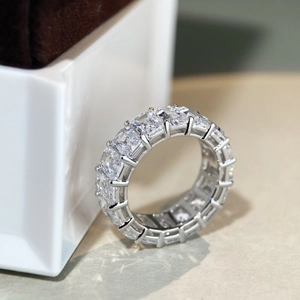 Macro shot of S925 sterling silver eternity ring with emerald cut zircon stones