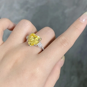 Detailed macro view of S925 silver ring featuring a heart-shaped yellow diamond gemstone