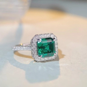 Classic S925 sterling silver ring with emerald-cut green stone and halo zircon settings