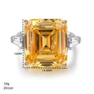 Macro view of 28ct emerald cut yellow zircon ring with side triangle stones