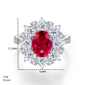 Macro detail of ruby zircon floral ring showing 17.2x16mm size and 5.4g weight data