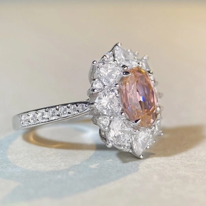 Luxurious S925 silver ring featuring an oval pink center stone with floral diamond halo