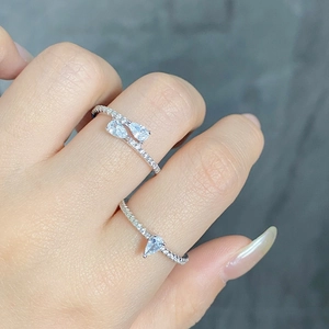 Close-up of S925 silver pear-cut teardrop rings with micro-pave zircon on hand