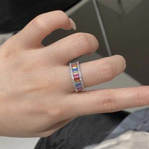 Detailed close-up of S925 silver rainbow ring with baguette gemstones and pavé crystals