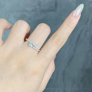 Detail of S925 silver ring featuring double pear-cut stones and pavé set diamonds