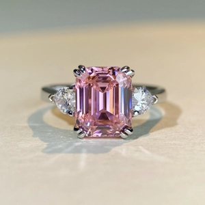 Macro shot of 4 carat pink emerald cut zircon ring with pear side stones in S925 silver