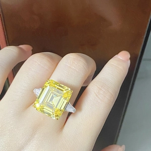 Close-up of a luxury S925 silver ring featuring a large emerald-cut yellow zircon stone