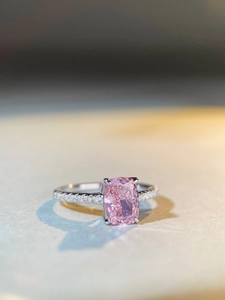 Detailed view of s925 silver ring featuring radiant cut pink gemstone and pavé diamonds