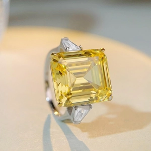 Classic S925 silver ring with 28ct radiant cut yellow stone and step-cut side gems