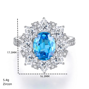 Vue macro d'une bague en zircon bleu ovale de 5,4g avec halo de diamants en argent