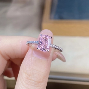 Close-up of cushion cut pink diamond ring in S925 silver with side accent stones