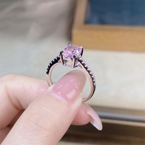 Macro shot of S925 silver ring featuring a radiant cut pink gemstone and side diamonds
