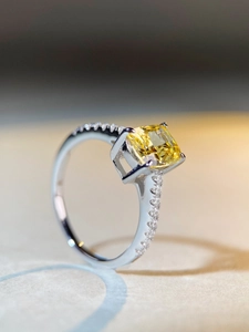 Macro detail of radiant cut yellow gemstone ring in S925 sterling silver setting