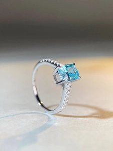Macro shot of S925 silver ring with radiant cut aquamarine stone and micro-pave setting