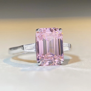 S925 silver ring featuring emerald-cut pink gemstone with baguette-cut side stones