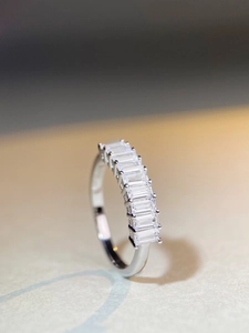 Close-up of S925 silver ring featuring seven emerald-cut cubic zirconia in a row