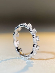 Macro side view of S925 sterling silver lace ring with pavé-set round zircon gemstones