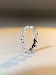 Macro shot of S925 sterling silver lace eternity ring with sparkling cubic zirconia stones