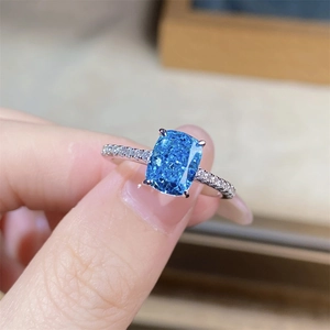 Macro shot of S925 silver ring featuring a radiant cut aquamarine gem in a 4-prong setting