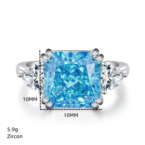 Macro view of a 10mm square blue zircon ring with triangle side stones in silver